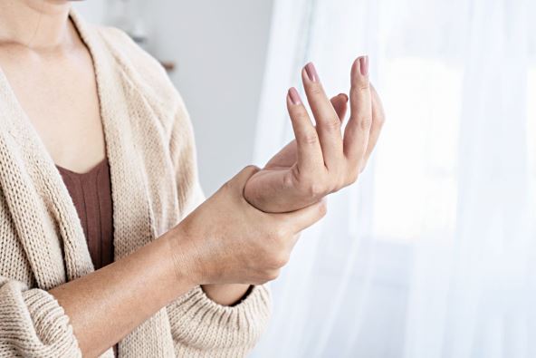 stockphotowomansufferingfromwristpainnumbnessorcarpaltunnelsyndromehandholdingherachejoint2093499736.jpg
