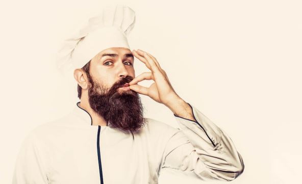 stockphotobeardedmalechefsisolatedonwhiteperfectprofessionalchefmanshowingsignfordelicious1525485404.jpg