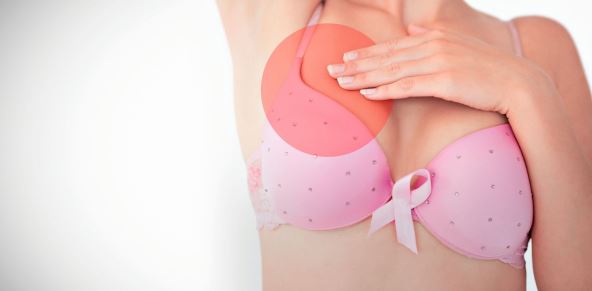 stockphotowomaninbrawithbreastcancerawarenessribbonagainstwhitebackgroundwithvignette710687632.jpg