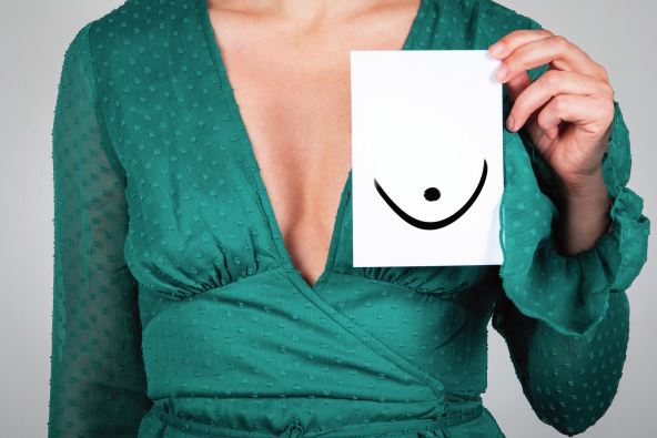 stockphotowomensbreasthealthbeautyandwellbeingwomaningreendress2041620629.jpg