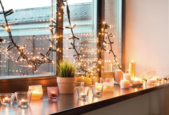 3--stockphotohyggedecorationandchristmasconceptcandlesburninginlanternsandfestivegarlandonwindow1213120561.jpg