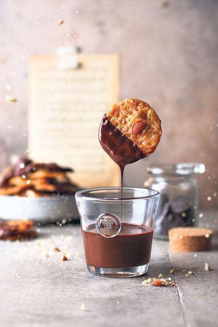 stockphotolevitationwithcookieschocolatealmondcookies2381036611.jpg
