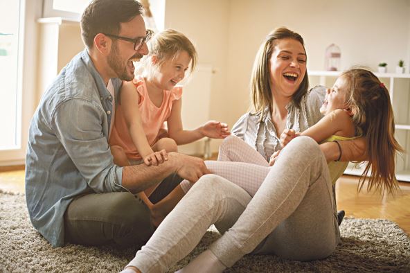2----stockphotohappyfamilywithtwodaughtersplayingathomefamilysittingonfloorandplayingtogether634089968.jpg