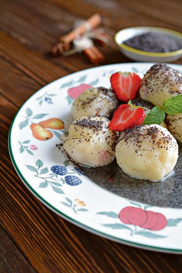 stockphotosweetboileddumplingsfilledwithstrawberrieswithapoppyseedsauce447965425.jpg