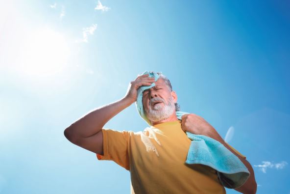 stockphotoseniormanwithtowelsufferingfromheatstrokeoutdoorslowangleview2018084783.jpg
