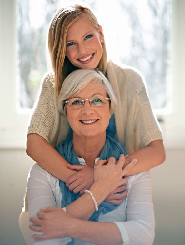 stockphotoilovemynannacroppedshotofanattractiveyoungwomanvisitinghergranfortea2224445111.jpg