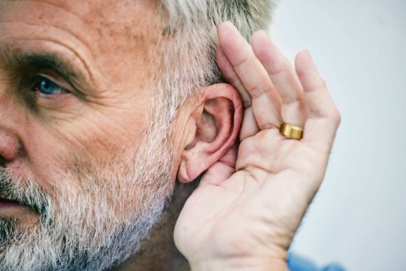stockphotoseniormanlisteningandhandonearorcuriousguywithgesturetoheargossipconversationor2349928863.jpg