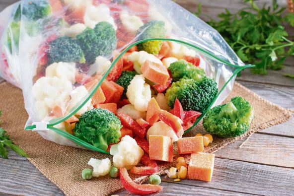 stockphotofrozenvegetablesinplasticbagsonatablefrozenfood2075446297.jpg