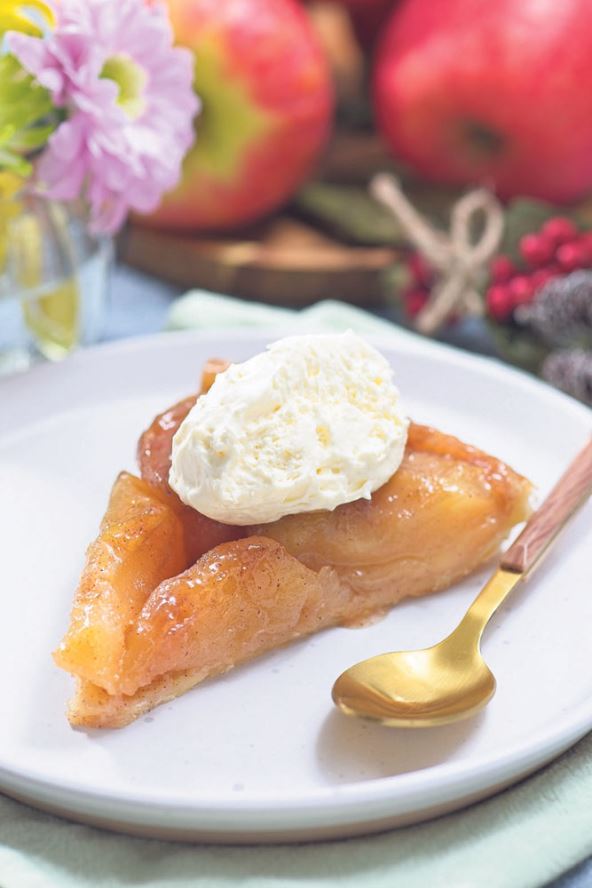 stockphotosliceofappletarttartinwithwhippedcreamfrenchupsidedowncakevertical2525363129.jpg