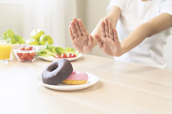 stock-photo-diet-dieting-asian-young-woman-girl-hand-push-out-refuse-deny-sweet-donut-dessert-doughnut-on-2498493265.jpg