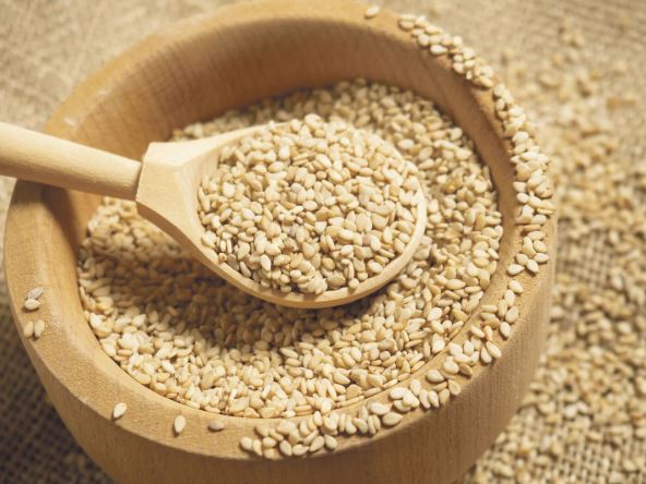 stock-photo-white-sesame-seeds-sesame-seeds-in-a-wooden-spoon-on-an-old-rustic-background-close-up-1933144136.jpg