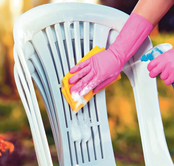 stock-photo-woman-doing-plastic-chair-cleaning-with-spray-foam-close-up-1221303160.jpg