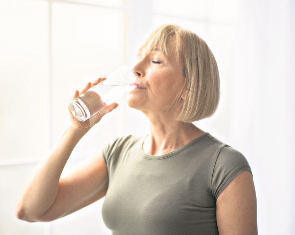 stock-photo-fit-senior-woman-drinking-clear-water-during-her-workout-break-at-home-mature-caucasian-lady-2511172409.jpg