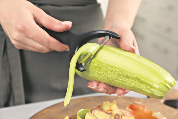 GLOSA  stock-photo-woman-peeling-fresh-zucchini-at-table-indoors-closeup-2434317801.jpg