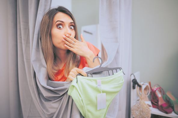 stock-photo--funny-woman-trying-on-panties-in-a-changing-room-embarrassed-girl-feeling-self-conscious-after-2343474181.jpg