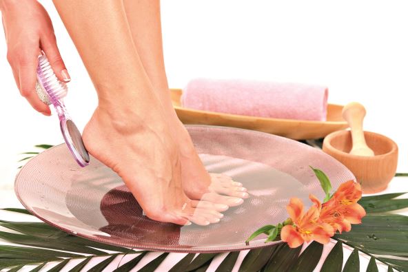 stock-photo-female-feet-in-spa-bowl-with-water-isolated-on-white-134415209.jpg