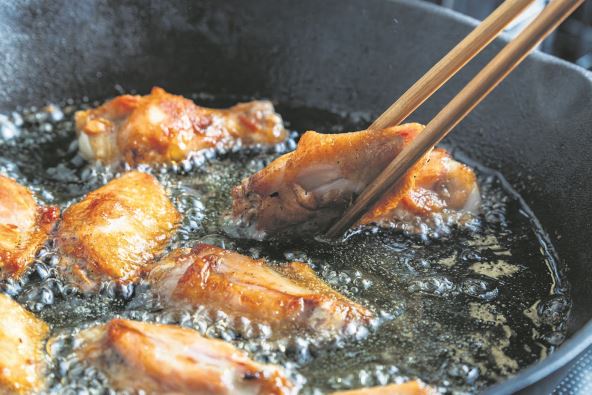 stock-photo-chicken-wing-fried-until-golden-brown-in-bubbling-hot-vegetable-oil-home-cooking-concept-2523848727.jpg