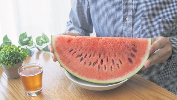 ANTR  stock-photo-a-man-eating-watermelon-watermelon-and-barley-tea-2340359271.jpg
