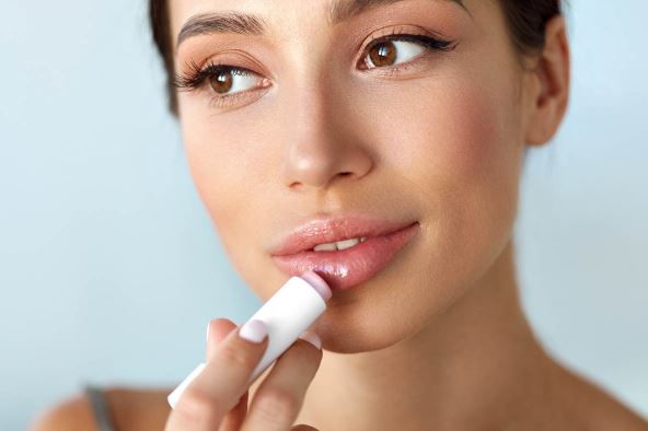 BALZAM  stock-photo-lips-protection-beautiful-woman-with-beauty-face-sexy-full-lips-applying-lip-balm-lipcare-stick-517995004.jpg
