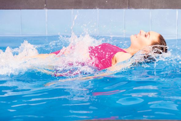 JACANJE TRBUSNIH MISICA  stock-photo-beautiful-young-woman-in-pink-swimsuit-swimming-in-blue-pool-on-her-back-young-female-swimmer-at-1172191240.jpg