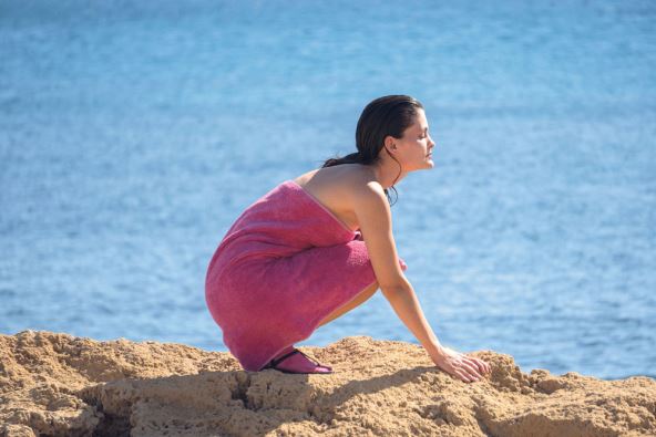 ANTRFILE   stock-photo-a-beautiful-young-woman-with-fair-skin-is-crouching-with-hands-resting-on-the-ground-with-the-2480434783.jpg
