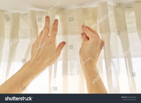 ZAVESE NA USICE  stock-photo-close-up-of-woman-hands-hanging-curtain-with-metal-hooks-on-ceiling-ledge-1686935866.jpg