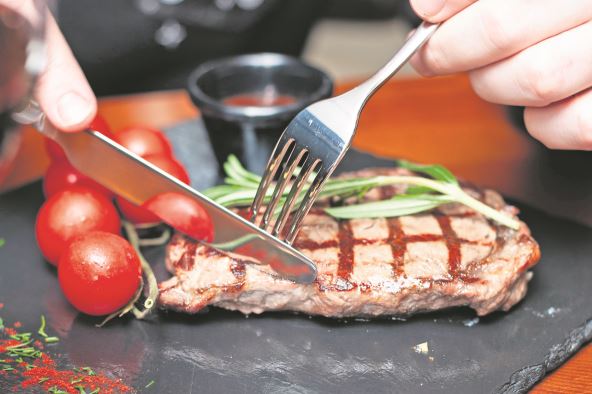 NULTA  stock-photo-steak-ribeye-on-black-plate-1540153880.jpg