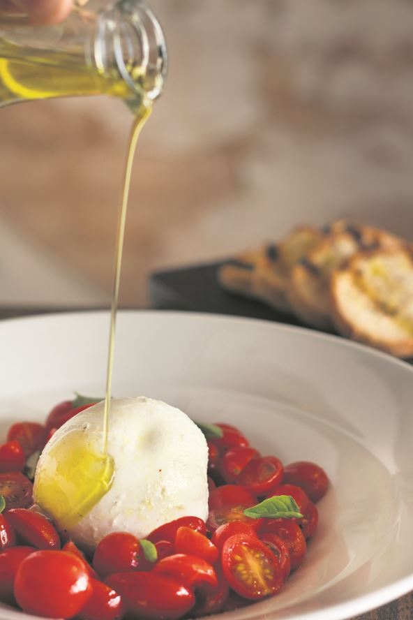 KRVNA GRUPA AB  stock-photo-tomatoes-with-fresh-cheese-and-olive-oil-dropped-olive-oil-and-toasted-bread-in-the-background-2413955983.jpg