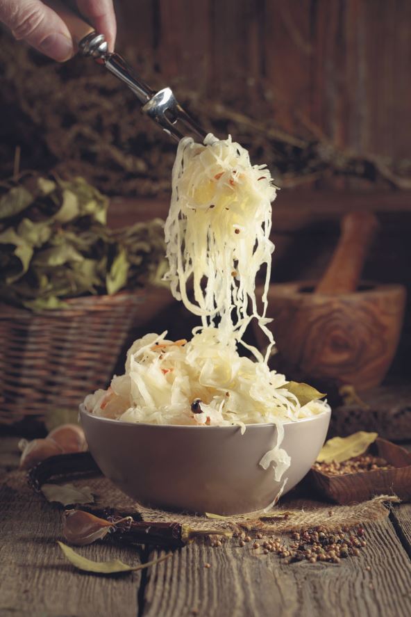 stock-photo-traditional-german-sauerkraut-with-spices-on-a-old-rustic-wooden-table-2571725167.jpg