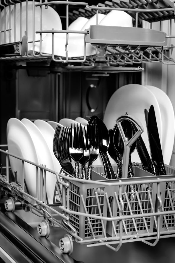 stock-photo-open-modern-dishwasher-with-clean-tableware-closeup-2226628025.jpg