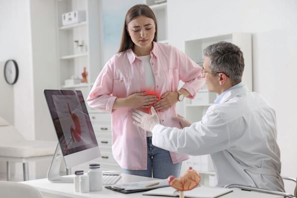 STA KADA ZGARAVICA DUGO TRAJE  stock-photo-gastroenterologist-examining-patient-with-stomach-pain-in-clinic-2471398781.jpg