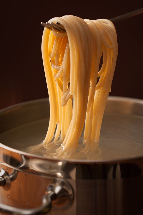 stock-photo-taking-just-cooked-al-dente-spaghetti-from-pot-2266898501.jpg