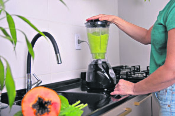 BLENDER  stock-photo--year-old-woman-preparing-green-juice-in-a-blender-2616686465.jpg