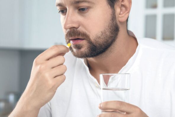 stock-photo-ANTIDEPRESIVI  depressed-man-with-glass-of-water-taking-antidepressant-pill-indoors-closeup-2394455727.jpg