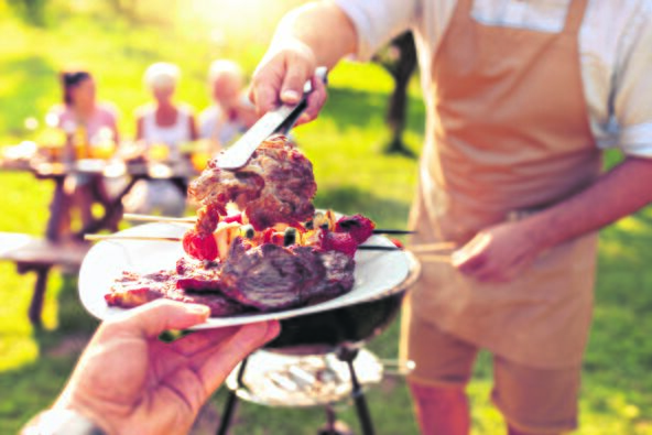 stock-photo-family-having-a-barbecue-in-a-park-leisure-food-family-and-holidays-concept-1149066665.jpg