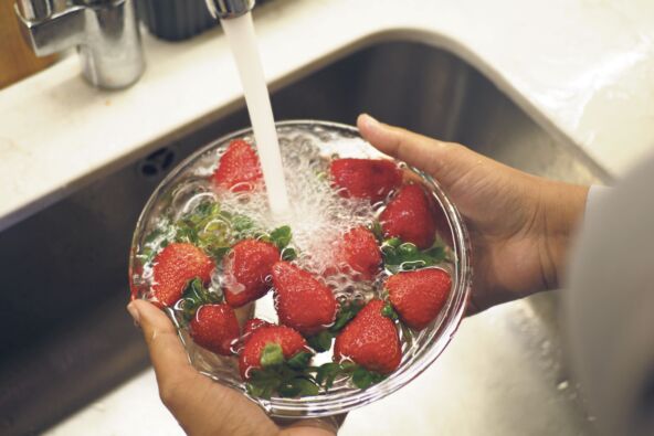 ANTRFILE  stock-photo-cleaning-fresh-strawberries-at-kitchen-sink-2598270463.jpg