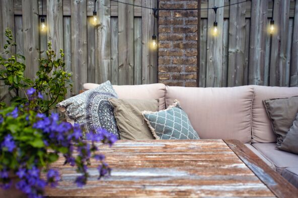 LAMPICE stock-photo-stylish-outdoor-garden-furniture-sofa-with-cushions-and-lamps-light-bulbs-hanging-cozy-modern-1750157171.jpg