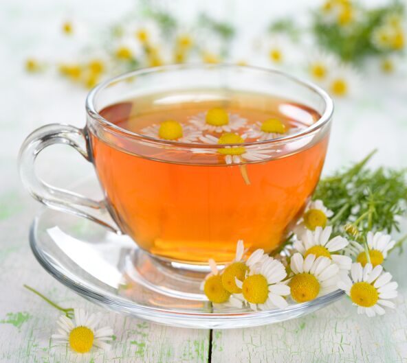 CAJ  stock-photo-chamomile-tea-in-a-glass-cup-on-a-white-table-137522696.jpg