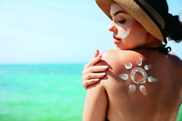 stock-photo-beautiful-woman-applying-sun-cream-on-tanned-shoulder-in-form-of-the-sun-sun-protection-skin-body-2753993905.jpg