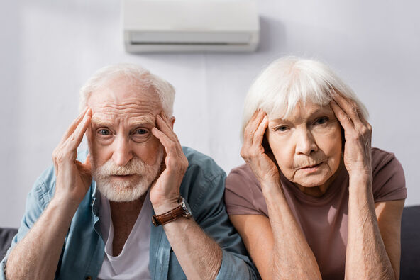 stock-photo-senior-couple-looking-at-camera-while-suffering-from-heat-at-home-1773640931.jpg
