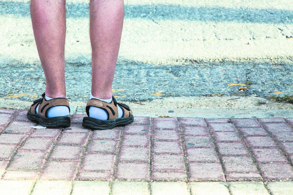 NIGDE BEZ OBUCE  stock-photo-funny-feet-covered-with-socks-and-sandals-410910742.jpg