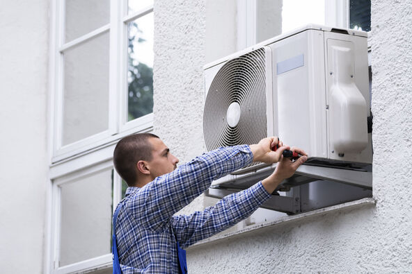 stock-photo-technician-cleaning-and-repairing-air-condition-appliance-ac-unit-maintenance-2005761359.jpg