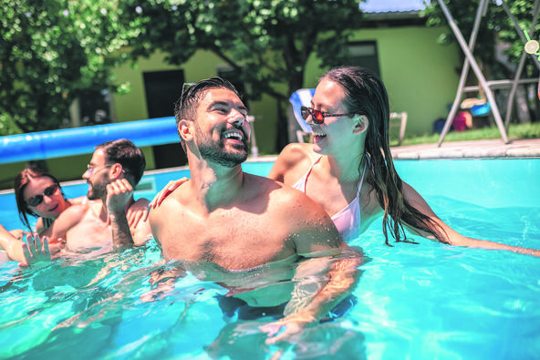 stock-photo-group-of-young-friends-enjoying-a-fun-time-together-in-a-swimming-pool-laughing-splashing-and-2663003757.jpg