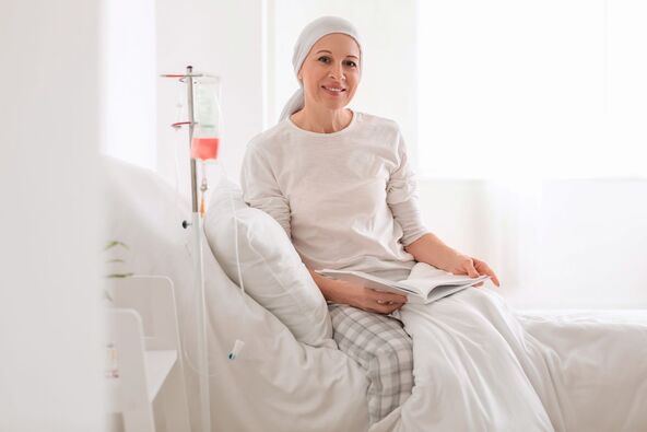 GLAVNA   stock-photo-mature-woman-after-chemotherapy-reading-book-in-clinic-2292944465.jpg