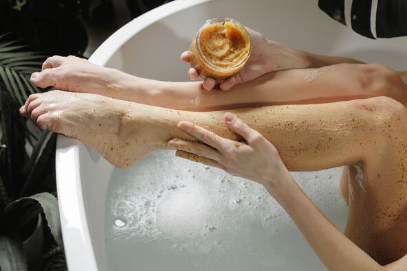 NEZAN PILING   stock-photo-a-woman-applies-a-natural-body-scrub-to-her-legs-while-relaxing-in-a-bathtub-promoting-self-care-2784455771.jpg