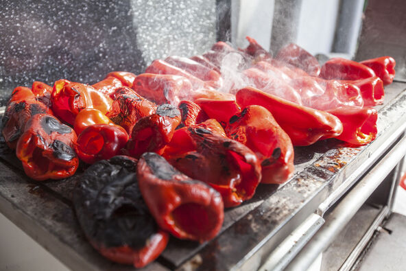 3     stock-photo-grilling-red-peppers-on-metal-plate-on-wood-burning-stove-traditional-preparing-delicious-food-in-1241958790.jpg