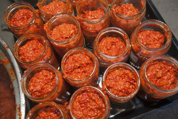 RECEPT     stock-photo-homemade-winter-food-called-ajvar-made-from-roasted-red-peppers-and-conserved-in-glass-jars-1241958763.jpg