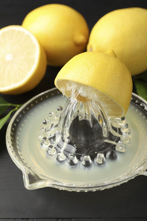 LIMUN   stock-photo-juicer-with-fresh-lemon-juice-and-fruits-on-black-wooden-table-closeup-2702733473.jpg