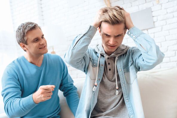 stock-photo-the-son-grabbed-his-head-and-ruined-the-hairstyle-from-his-father-s-teachings-dad-teaches-son-how-1836389173.jpg