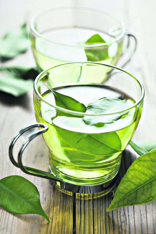 ZELENI CAJ   stock-photo-closeup-of-fresh-green-tea-focus-on-the-tea-leaves-in-the-water-66856315.jpg